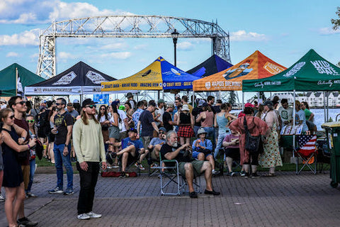Crowded beer festival with beer tents. 