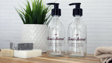 Bar soap and two soap bottles with clear labels.